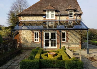 Black steel veranda at back of cottage house