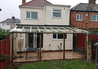 Wood veranda lean-to system at back of house